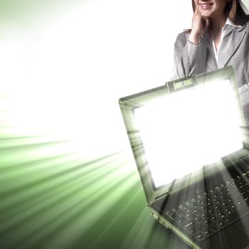 Image of notebook with shining screen and light