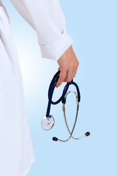 Portrait of happy successful young female doctor holding a stethoscope