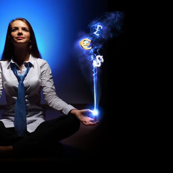 Businesswoman with financial symbols around her on the background