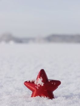 a red star in a winter landscape