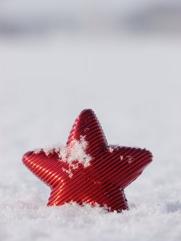 a red star in a winter landscape