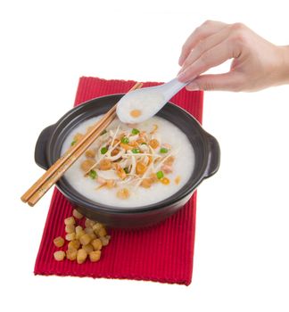 Porridge, scallop & chicken Porridge (congee) served in claypot