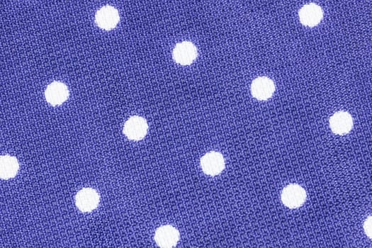 Close up shot of violet polka dot seamless fabric texture