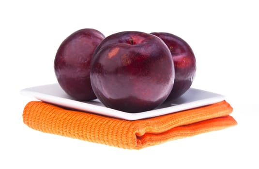 Plum. Ripe plum fruit on the background
