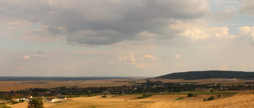 Panorama of northern French countryside and harvested wheat fields
