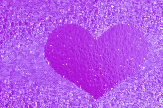 close-up shot of a colorful violet crystal heart bachground