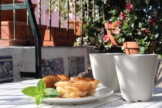 Tasty cakes in Portugal style and tea