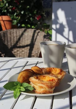 Tasty cakes in Portugal style and tea

