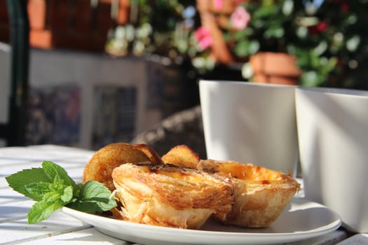 Tasty cakes in Portugal style and tea