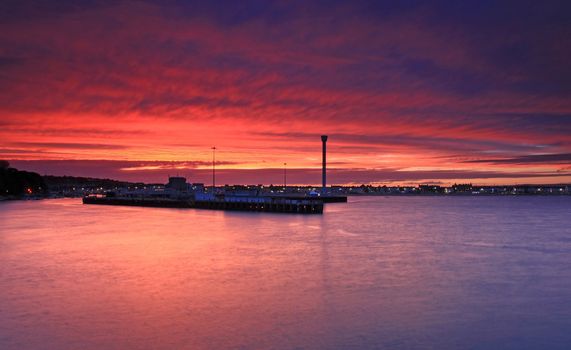 The sunsets over Weymouth seafront taken from view over the sea