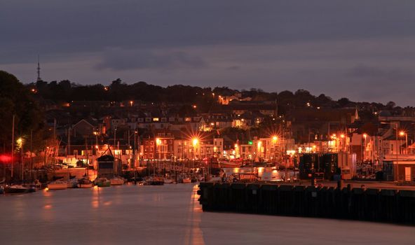 Harbnour at night in weymouth dorset southern Britian