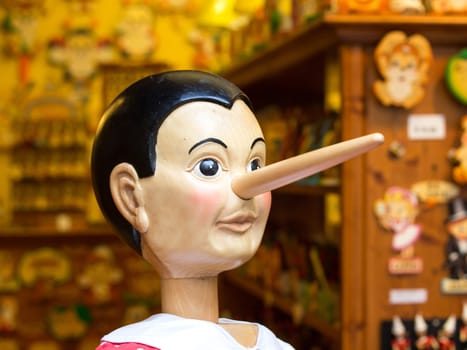 wooden pinocchio doll with long nose