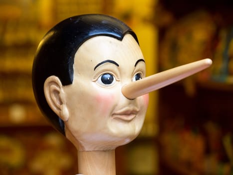 Wooden pinocchio doll with his long nose