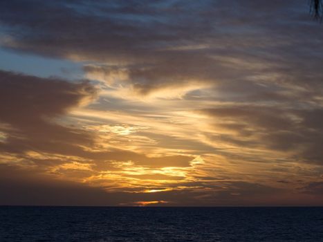 orange and blue sky sunset over the sea