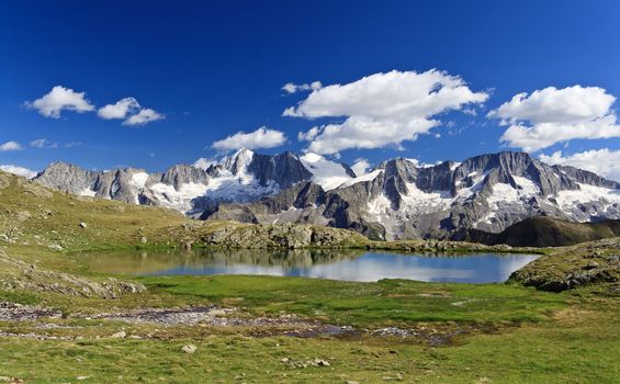 Strino lake is a little amazing lake in italian alps in Val di Sole, Trentino. On background Presanella glacier