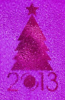 Closeup shot of Christmas tree crystal magenta background