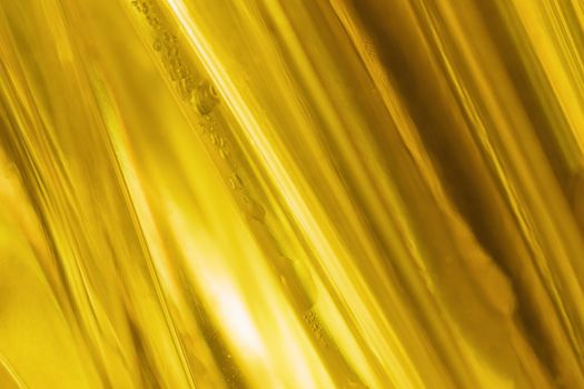 close-up shot of abstract golden glass background