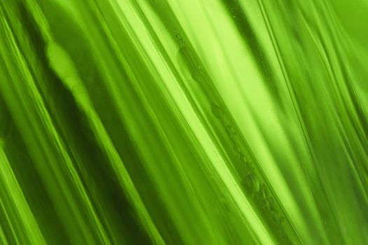 close-up shot of abstract green glass background