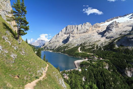 summer view of mount Marmolada and Fedaia lake, Trentino, Italy