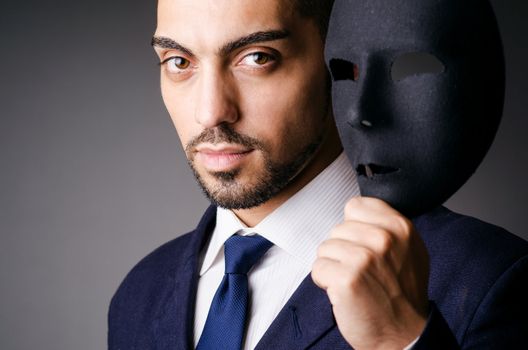 Man with black mask in studio