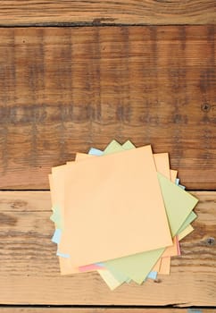 collection of various note papers on wooden background