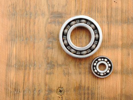 steel ball bearings on wooden background