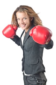 Young businesswoman in boxing concept