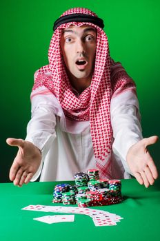 Arab playing in casino - gambling concept with man