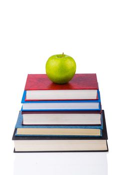 Back to school concept with books and apple