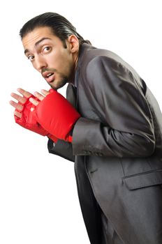 Businessman with boxing gloves on white