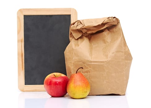 School lunch with fruit and black chalkboard ready for your text.