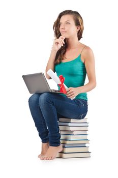 Student with netbook sitting on books