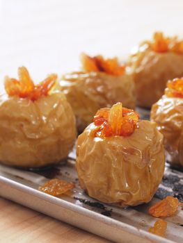 close up of a tray of golden baked apples