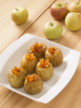 close up of a plate of golden baked apples