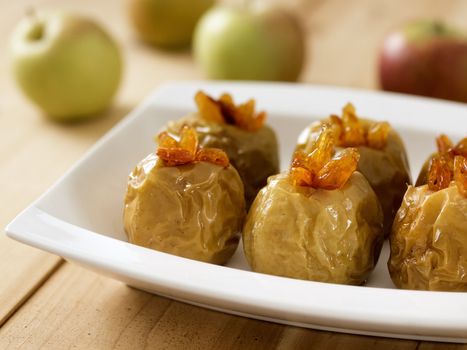 close up of a plate of golden baked apples