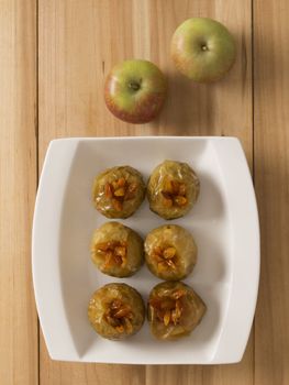 close up of a plate of golden baked apples