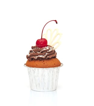 Cupcake with chocolate cream and cherry isolated on white 