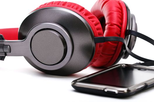 Fashion headphones made of red leather and player on a white background.