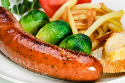 German sausage with potatoes, cabbage and other vegetables.