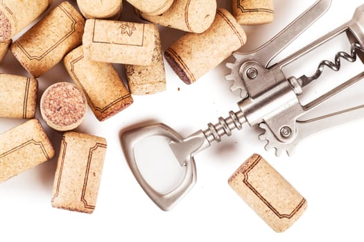 Corkscrew with extracted corks on white background