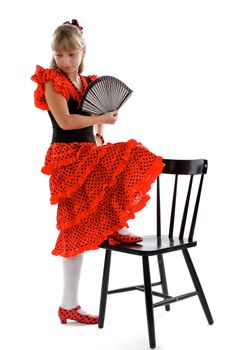Young Girl in Posing of Flamenco. Traditional Costume and Fan
