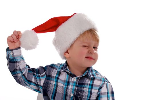 Merry Christmas Boy with Santa Hat Winks closeup on white background