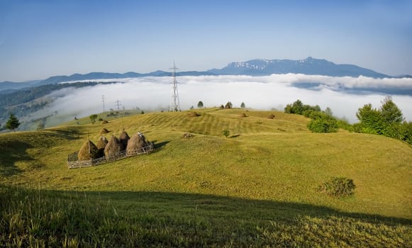 mountain clouds misty rural landscape in Romania