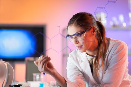 Portrait of a confident female health care professional in his working environment writing structural chemical formula on a glass board.