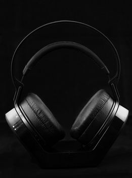 Black modern Headphones on a black background