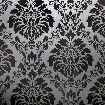 Background pattern of a vintage floral carpet design in classical black and white
