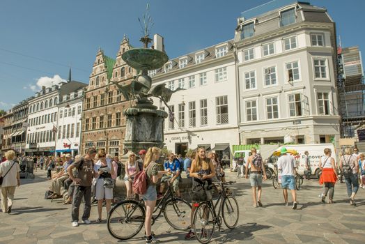 Copenhagen, Denmark - August 2012. Tourists have a rest in the center of Copenhagen.