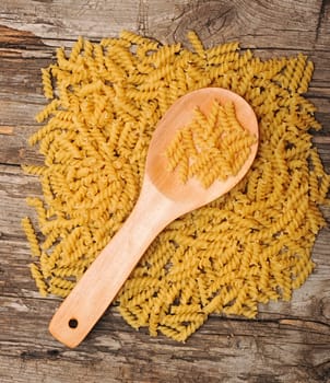 Food theme: uncooked vermicelli background on wooden table