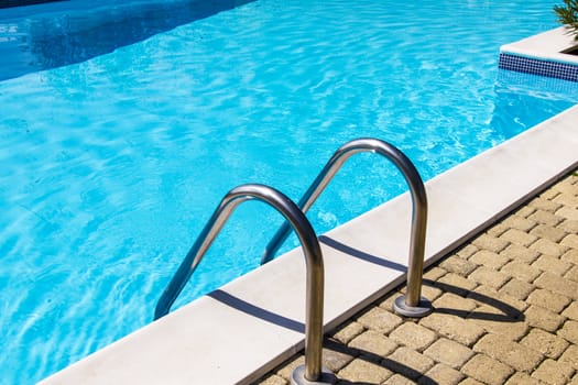 Swimming pool and chrome ladder 