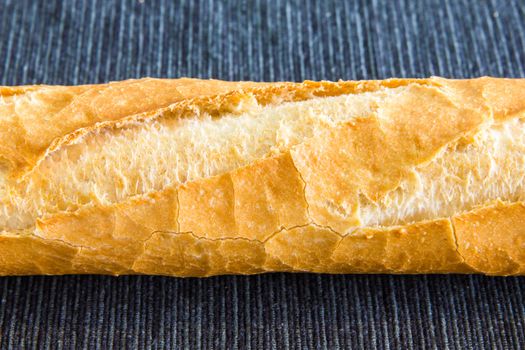 Closeup of french baguette over a black cloth